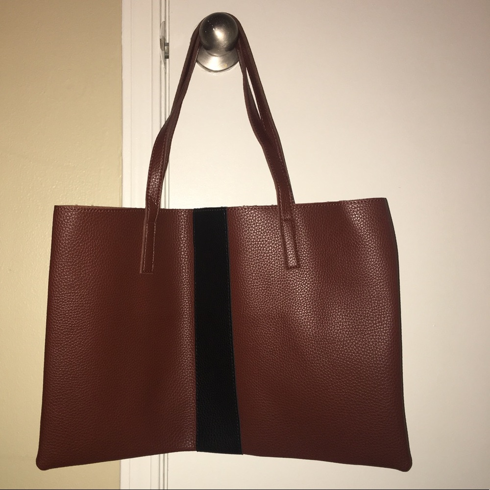 Brown purse with a black stripe